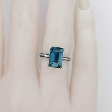Load image into Gallery viewer, 4ct Emerald Cut Teal Sapphire Black Gold Engagement Ring