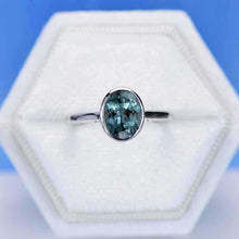 Load image into Gallery viewer, 3 Carat Oval Teal Sapphire Bezel Set Yellow Gold Engagement Ring
