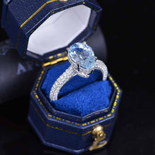 Load image into Gallery viewer, 4 Carat Pear Cut Aquamarine Hidden Halo Gold Engagement Ring