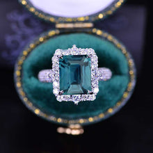 Load image into Gallery viewer, 4Ct Teal Sapphire Engagement Ring Halo Emerald Step Cut Engagement Ring