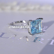 Load image into Gallery viewer, 3 Carat Princess Cut Aquamarine Hidden Halo Gold Engagement Ring