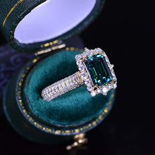 Load image into Gallery viewer, 3Ct Green Moissanite Engagement Ring Halo Emerald Step Cut Moissanite Engagement Ring
