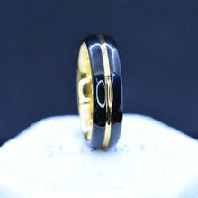 Load image into Gallery viewer, Mirror polished black tungsten band, with yellow gold color plated center strip  polished beveled edges.
