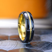 Load image into Gallery viewer, Mirror polished black tungsten band, with yellow gold color plated center strip  polished beveled edges.
