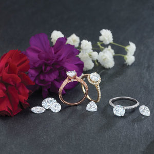 14K Gold 6.5 mm Round Forever One™ Moissanite & 1/10 CTW Diamond Engagement Ring