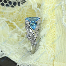 Load image into Gallery viewer, 3.0 Carat Blue Topaz 8x6mm Emerald Cut Center Stone and two Pear 6x4mm 2x0.5 Carat Wing Ring with 10K white Gold ring size 9

