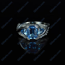 Load image into Gallery viewer, 3.0 Carat Blue Topaz 8x6mm Emerald Cut Center Stone and two Pear 6x4mm 2x0.5 Carat Wing Ring with 10K white Gold ring size 9
